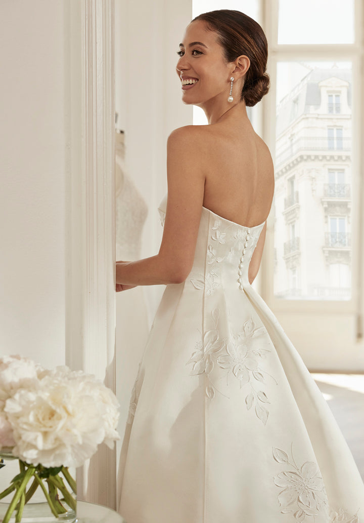 Strapless silk wedding dress with a tulip modern cut featuring oil-painted jasmine flowers made by Rosa Clara Couture available at Estrelle Bridal Toronto