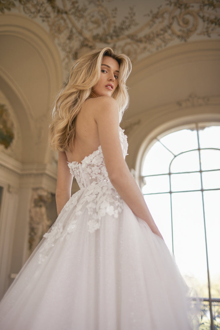 Floral A-line wedding dress with plunged strapless neckline, elegant and romantic look for your fairytale wedding.