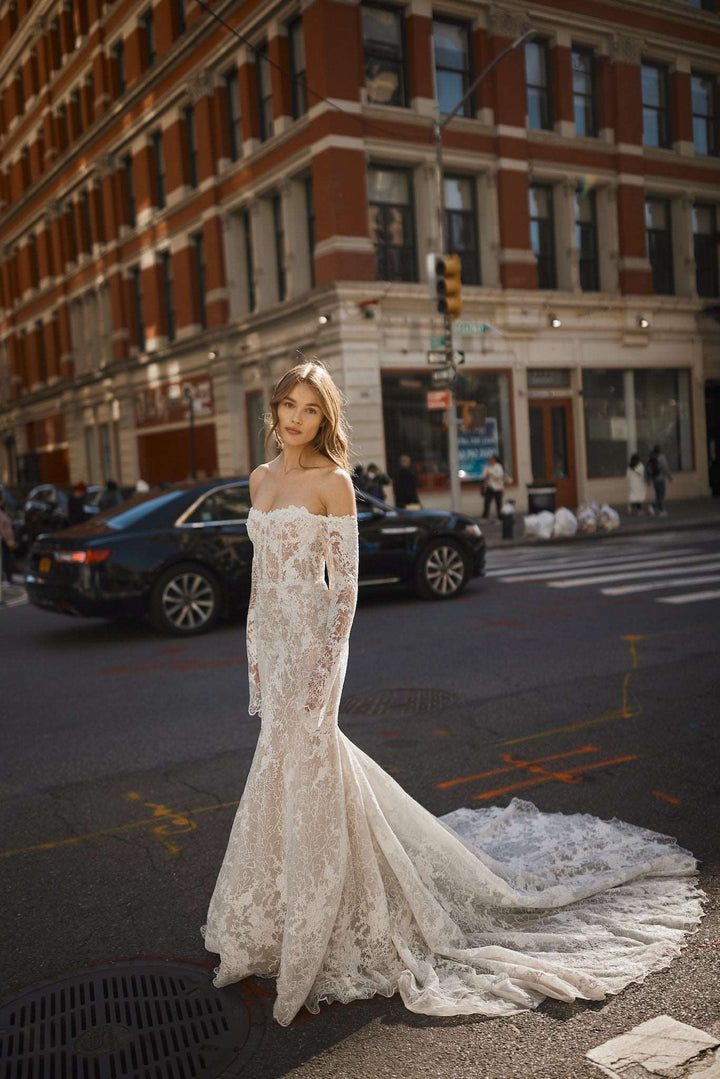 Elegant and sexy long sleeve lace wedding dress designed by Netta BenShabu available at Estrelle Bridal Toronto.