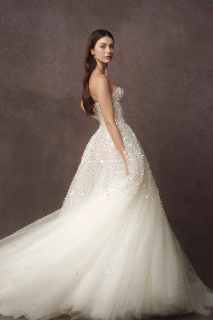 Beautiful and luxury strapless wedding gown by Nicole Felicia Couture available at Estrelle Bridal Toronto.